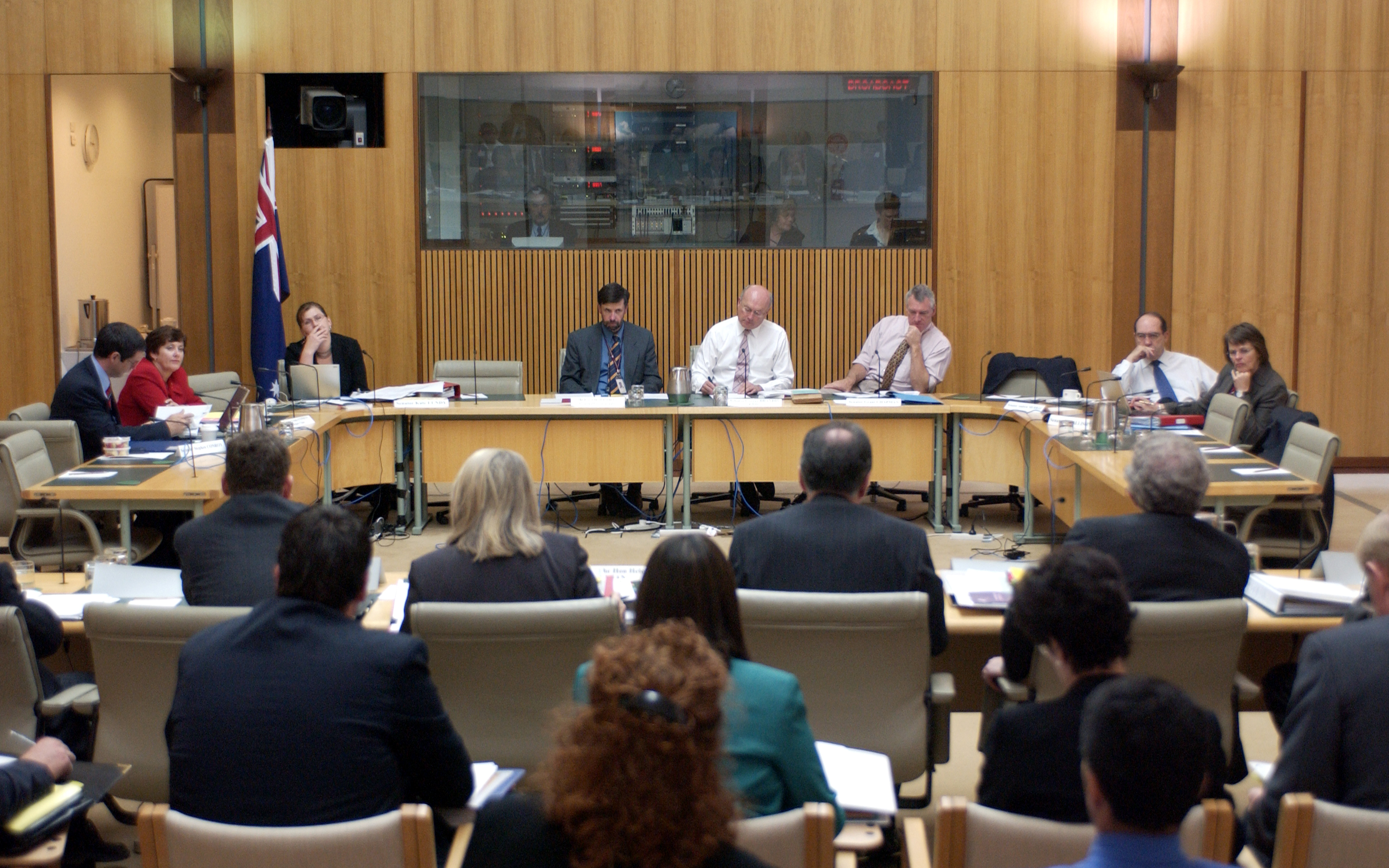Senator the Hon Helen Coonan, Minister for Communications, Information Technology and the Arts, and officers from the Department of the Treasury and related agencies appearing before an additional estimates hearing of the Economics Legislation Committee, 17 February 2005. Seated facing camera L-R: Senators Stephen Conroy, Ursula Stephens [Deputy Chair] and Kate Lundy, Dr Anthony Marinac [Acting Secretary], Senators George Brandis [Chair], Grant Chapman, Andrew Murray and Lyn Allison. DPS Auspic.