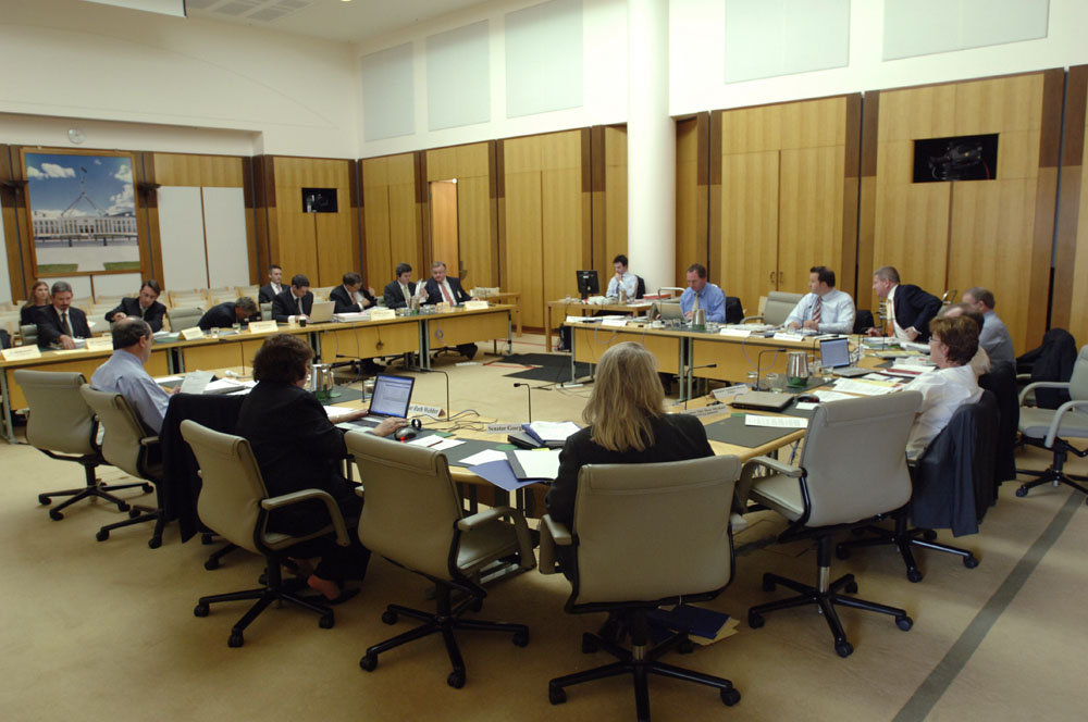 Standing Committee on Economics questioning Senator the Hon Stephen Conroy, Minister representing the Treasurer, and officers from the Macroeconomic Group of the Treasury at an additional estimates hearing, 20 February 2008. Seated facing witnesses clockwise from top: Senators Barnaby Joyce, David Bushby, Mitch Fifield and Alan Eggleston [Deputy Chair] (obscured), John Hawkins [Secretary] (obscured), Senators Annette Hurley [Chair], Helen Coonan, Ruth Webber and Andrew Murray. DPS Auspic.