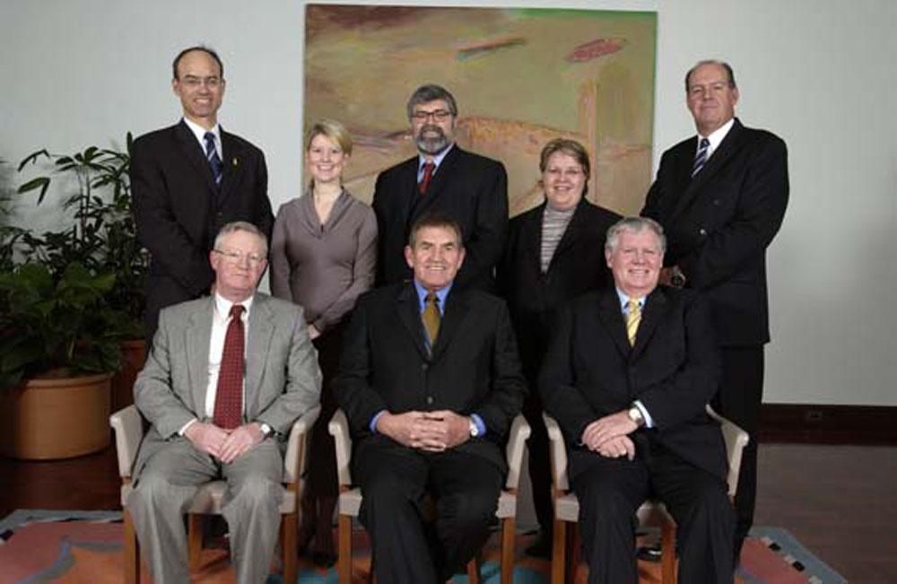 Standing Committees on Employment, Workplace Relations and Education (Legislation and References), 11 August 2004. Standing L-R: Senators Guy Barnett, Natasha Stott Despoja, Kim Carr, Trish Crossin and David Johnston. Seated L-R: John Carter [Secretary], Senators George Campbell [Deputy Chair, Legislation] and John Tierney [Chair, Legislation]. DPS Auspic.