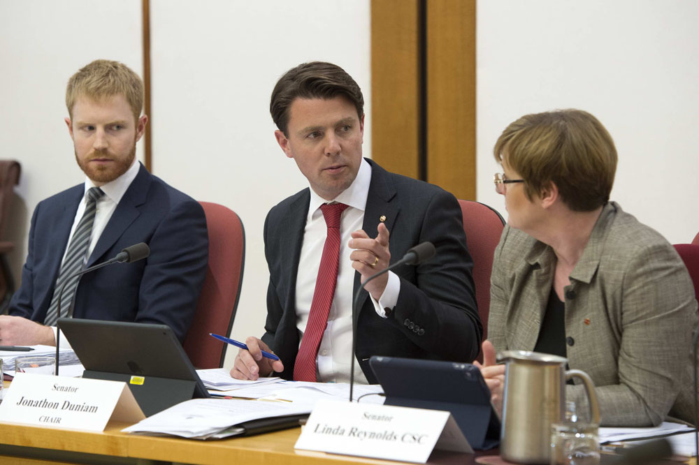 Environment and Communications Legislation Committee chair Senator Jonathon Duniam (centre), Senator Linda Reynolds and Colby Hannan [Acting Secretary], 24 October 2017. DPS Auspic.