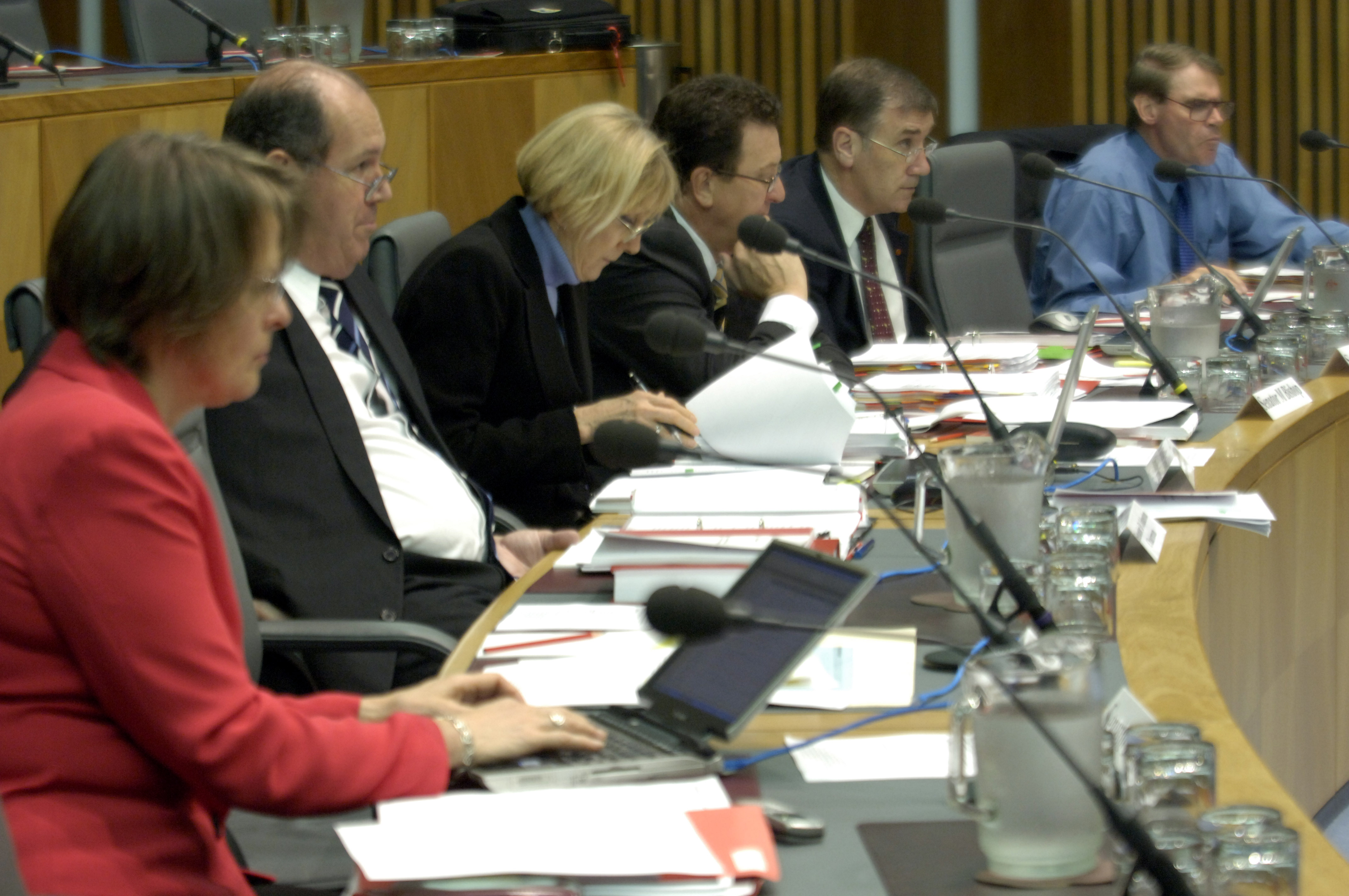 Members of the Senate Foreign Affairs, Defence and Trade Legislation Committee at a supplementary budget estimates hearing, 2 November 2005. L-R: Senators Lyn Allison and David Johnston, Dr Kathleen Dermody [Secretary], Senators Mark Bishop, John Hogg and John Faulkner. DPS Auspic.