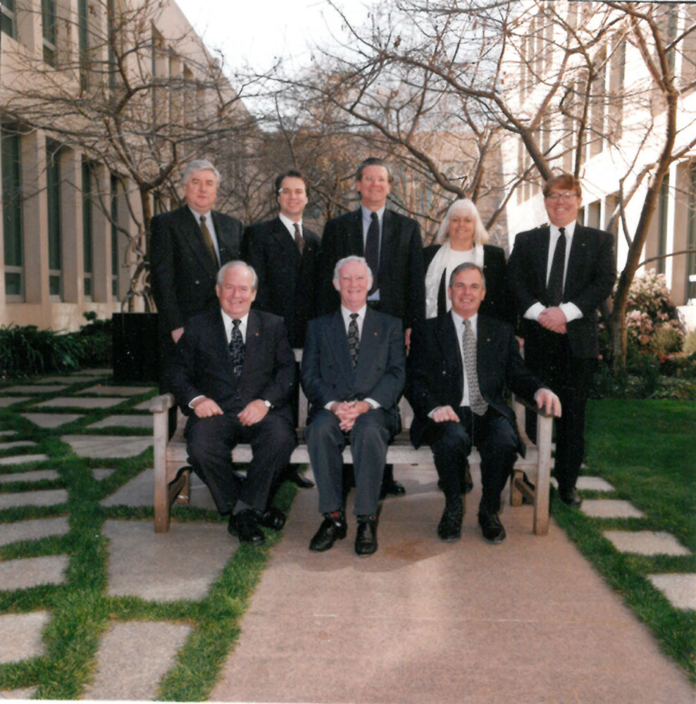 Rural and Regional Affairs and Transport Legislation Committee, 1999. Standing from left: Senators Michael Forshaw, Julian McGauran, Kerry O'Brien and Jeannie Ferris, Andrew Snedden [Secretary]; Seated L-R: Senators Winston Crane, John Woodley, Paul Calvert and Jeannie Ferris.