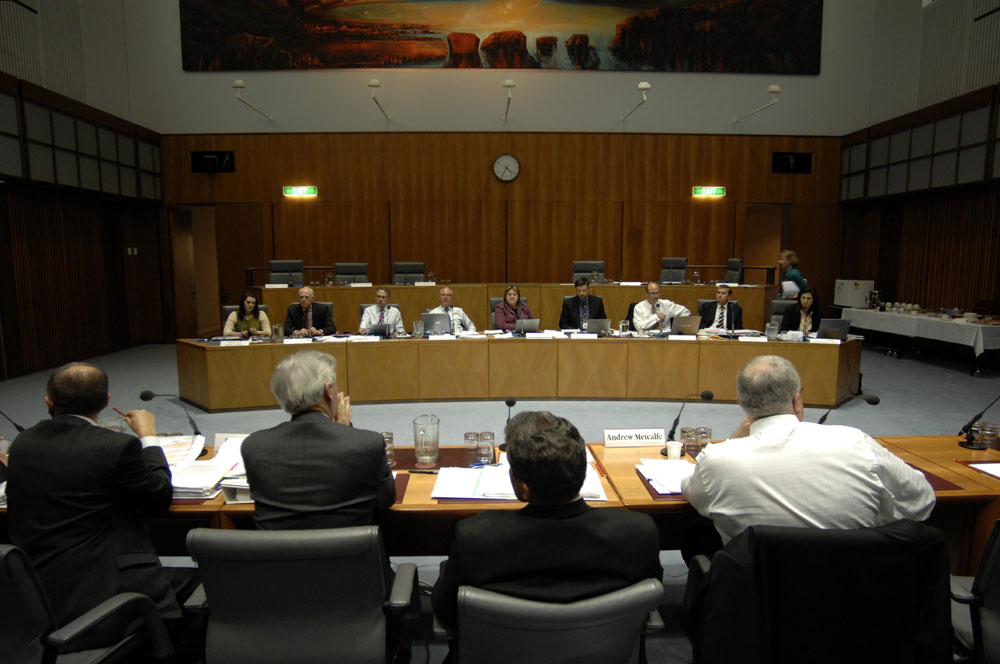 Standing Committee on Legal and Constitutional Affairs questioning Senator the Hon Chris Evans, Minister for Immigration and Citizenship, and officers from the Department of Immigration and Citizenship at a supplementary budget estimates hearing, 21 October 2008. Seated facing camera L-R: Senators Sarah Hanson-Young, Russell Trood, Don Farrell, Gavin Marshall and Trish Crossin [Chair], Peter Hallahan [Secretary], Senators Guy Barnett [Deputy Chair], Chris Ellison and Concetta Fierravanti-Wells. Senator Mary Jo Fisher walking towards top row of seats. DPS Auspic. 