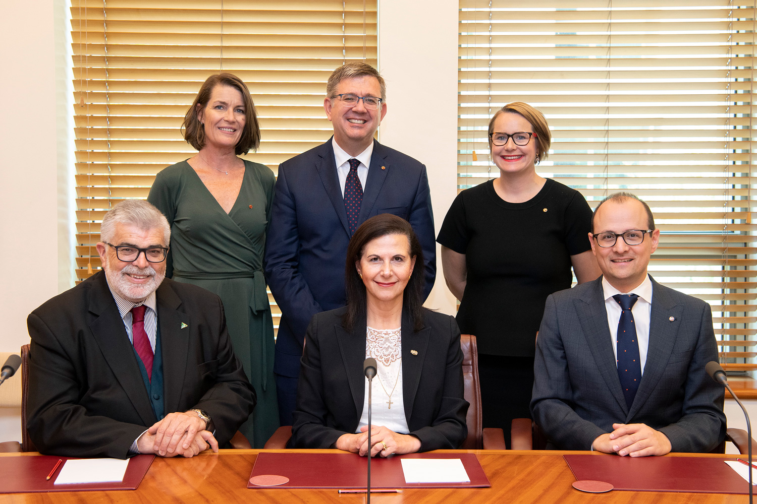 Scrutiny of Delegated Legislation Committee, 5 February 2020. Seated L-R: Senators Kim Carr, Concetta Fierravanti-Wells and Raff Ciccone. Standing L-R: Senators Perin Davey, Paul Scarr and Nita Green.