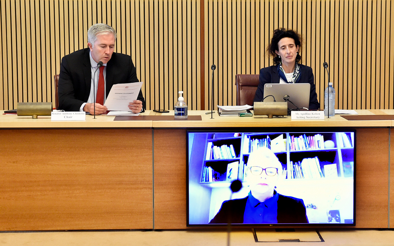 Senators Anthony Chisholm [Chair] and Janet Rice [via video] and Acting Committee Secretary Apolline Kohen, 27 August 2020. DPS Auspic.