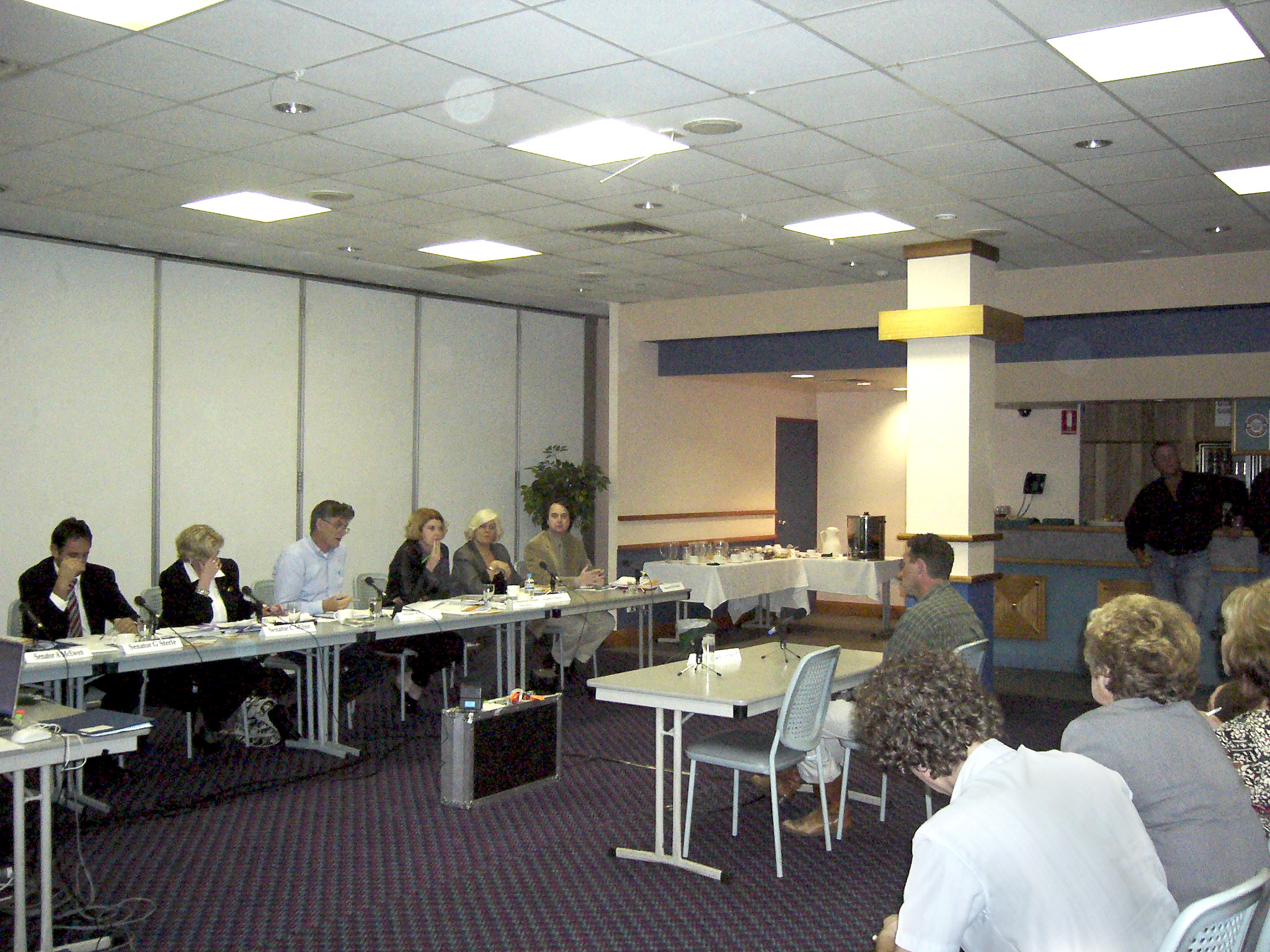 \x3cp\x3eRural and Regional Affairs and Transport Legislation Committee hearing evidence from witness Michael Benham at a public hearing in Emerald, Qld, of its inquiry into the Department of Agriculture, Fisheries and Forestryâ€™s administration of the citrus canker outbreak, 28 July 2005. Seated L-R: Senators Glenn Sterle, Christine Milne and Bill Heffernan [Chair], Maureen Weeks [Secretary], Senators Jeannie Ferris and Julian McGauran.\x3c/p\x3e