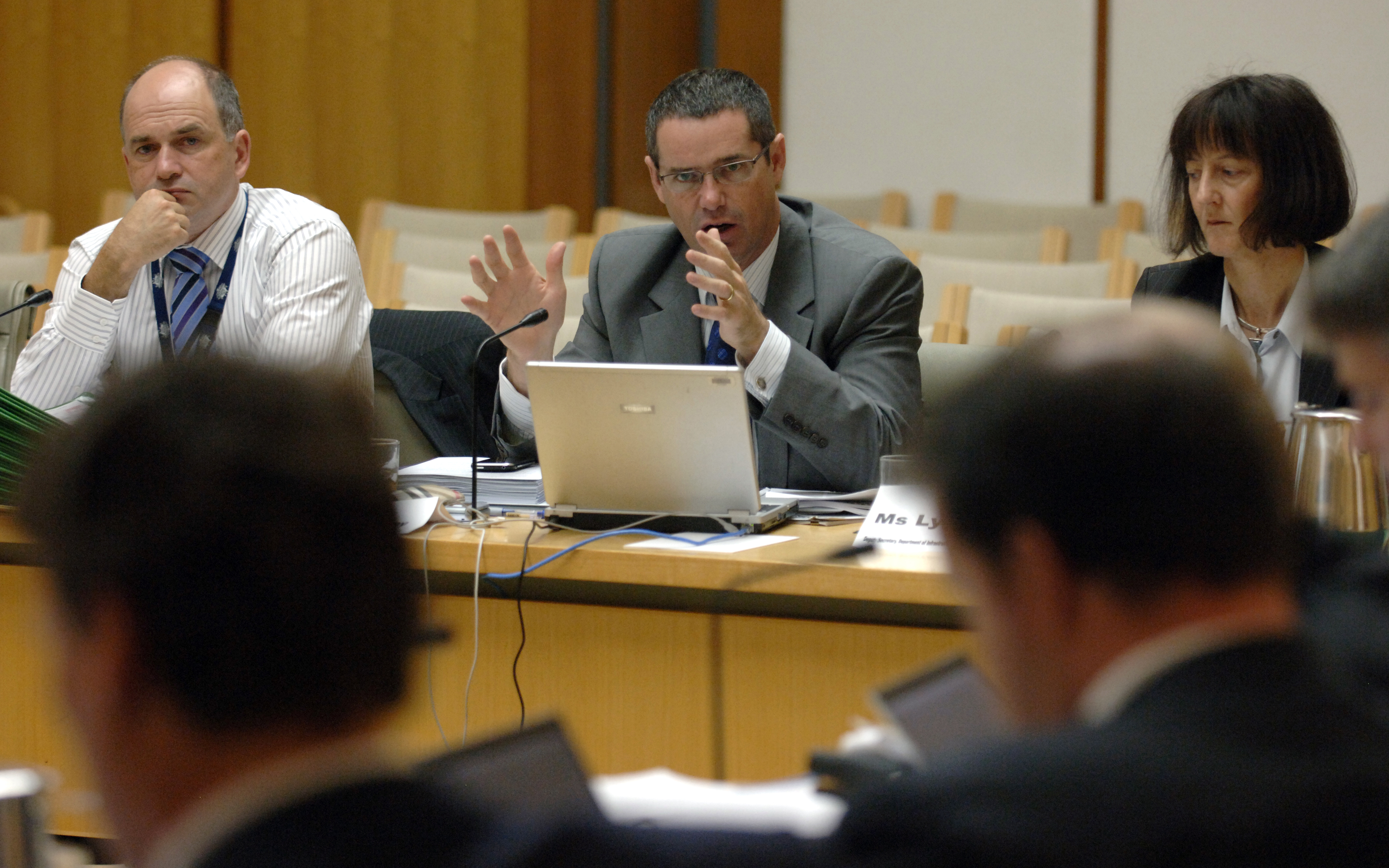 \x3cp\x3eSenator Stephen Conroy, Minister for Broadband, Communications and the Digital Economy, answering questions during the hearing, 24 February 2009. The minister is flanked by Deputy Secretaries of the Department of Infrastructure, Transport, Regional Development and Local Government, Andrew Tongue and Lyn O\'Connell. DPS Auspic.\x3c/p\x3e