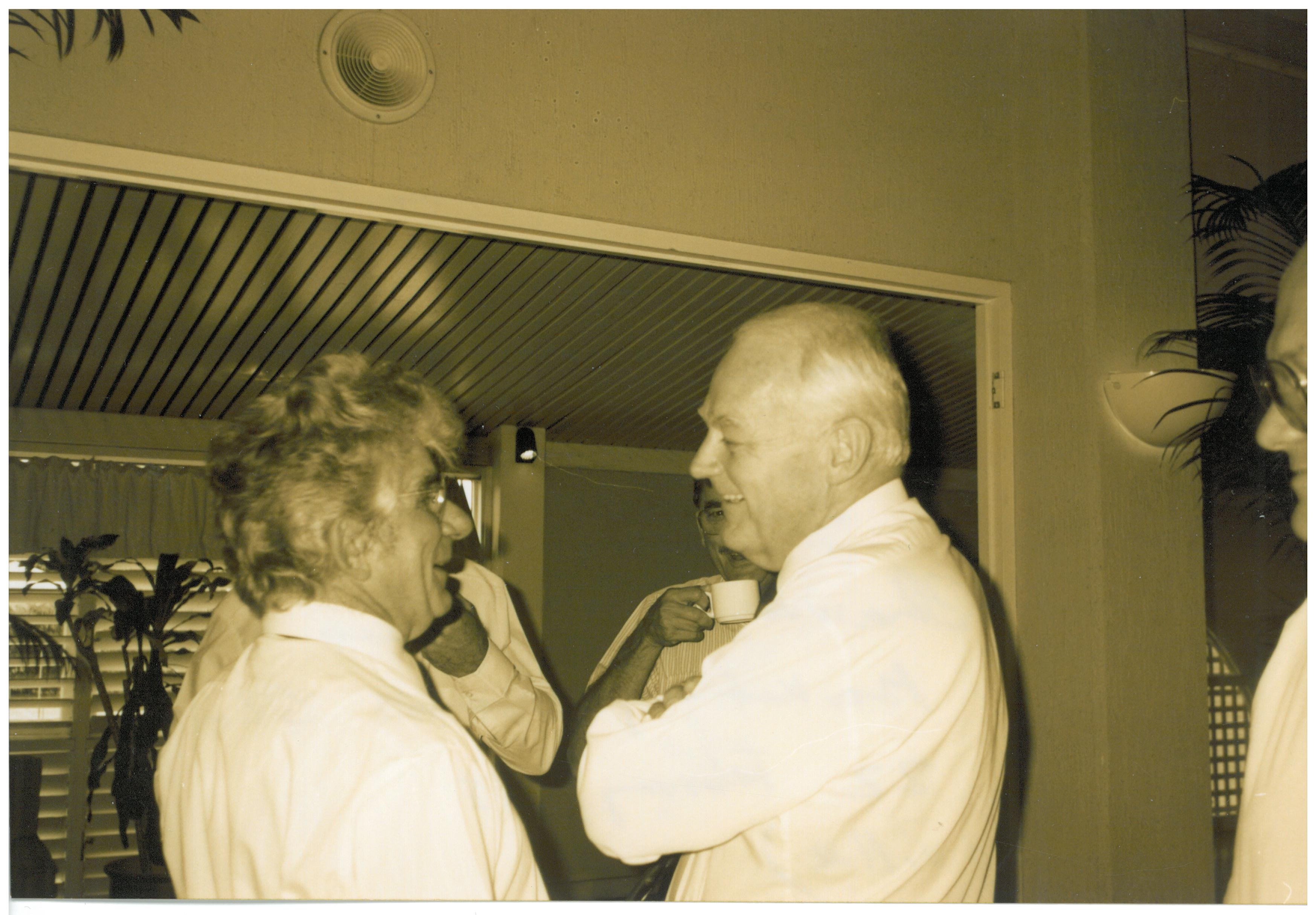 \x3cp\x3eCommittee chair Senator John Herron (right) speaking to witnesses Remzi Mulla [Chairman, Tobacco Leaf Marketing Board, Queensland] during a break in the Cairns hearing, 22 February 1995.\x3c/p\x3e