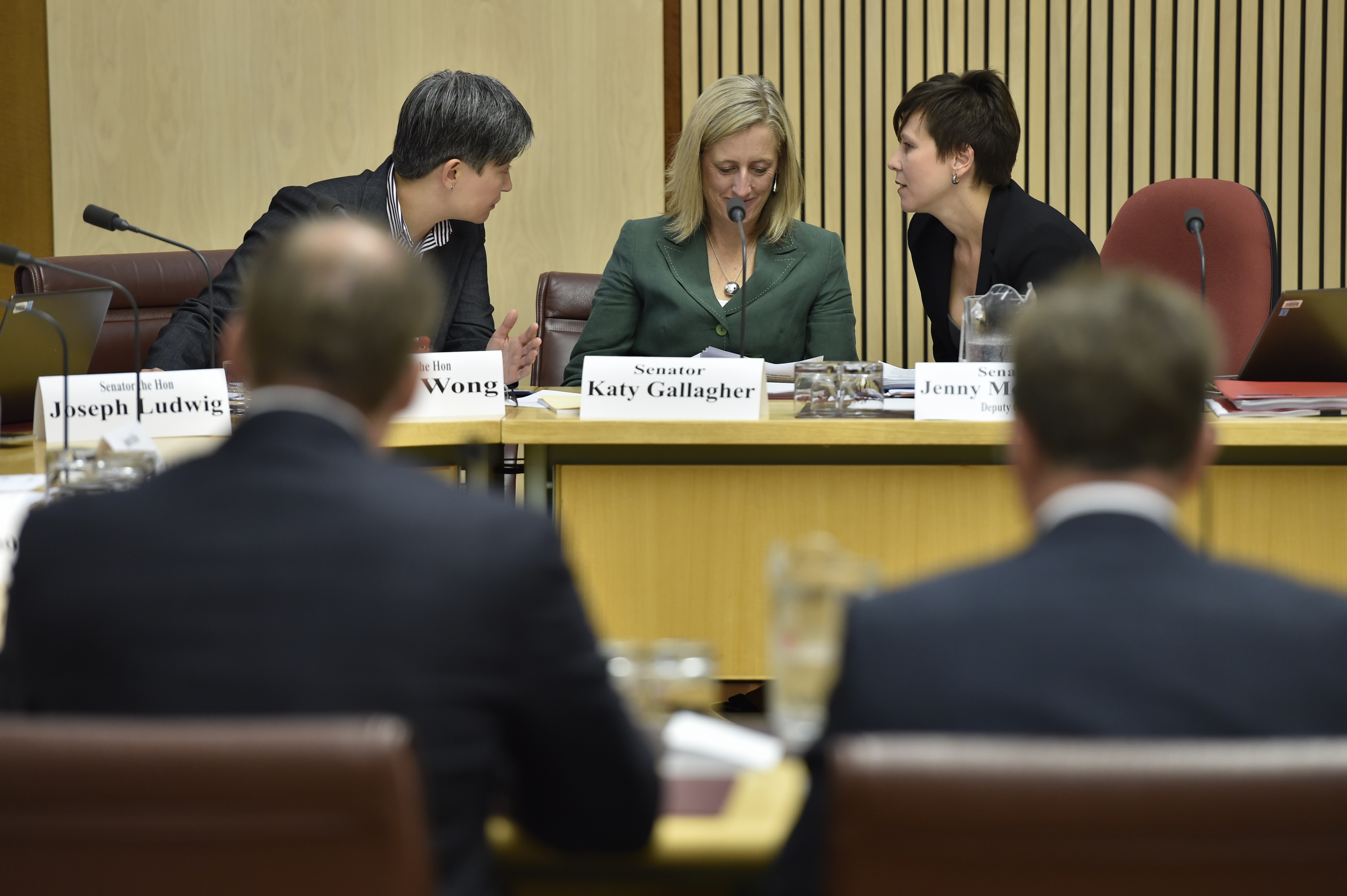 \x3cp\x3eCommittee members Senators Penny Wong, Katy Gallagher and Jenny McAllister conferring during the hearing, 9 February 2016. DPS Auspic.\x3c/p\x3e