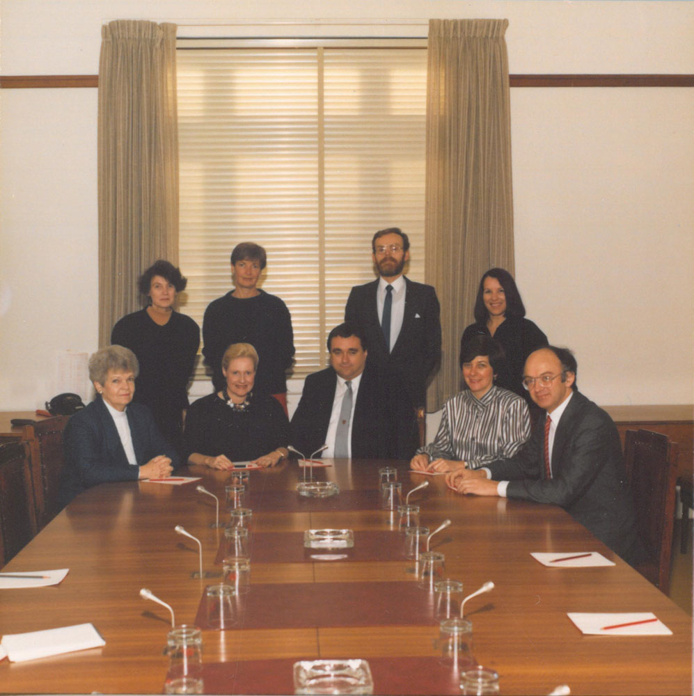 Standing Committee on Regulations and Ordinances, 1988. Standing L-R: Ann Millar [Research Officer], Jan Martin [Typist], Peter Oâ€™Keeffe [Secretary] and Helen Reid [Parliamentary Officer to Committee]. Seated L-R: Senators Patricia Giles, Bronwyn Bishop, Bob Collins [Chair], Kay Patterson and Bob McMullan.
