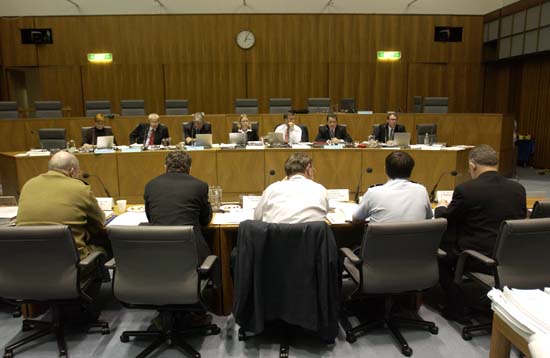 \x3cp\x3eForeign Affairs, Defence and Trade Legislation Committee questioning Senator the Hon Robert Hill, Minister for Defence, and officers from the Department of Defence at a budget estimates hearing, 1 June 2004. Seated facing camera L-R: Senators Marise Payne, Alan Ferguson and Sandy Macdonald, Saxon Patience [Acting Secretary], Senators Andrew Bartlett, Chris Evans and John Faulkner. DPS Auspic.\x3c/p\x3e