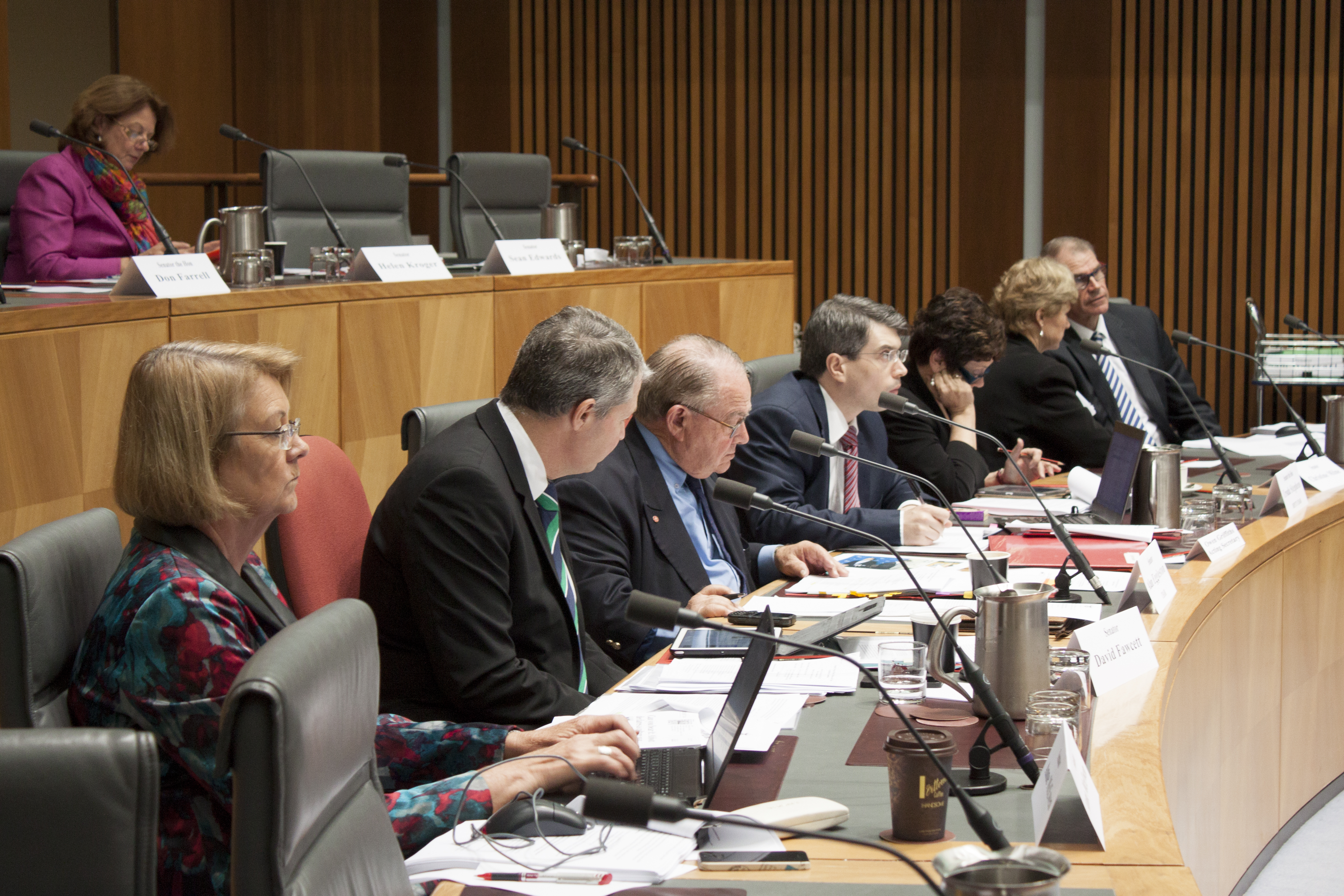 \x3cp\x3eForeign Affairs, Defence and Trade Legislation Committee budget estimates hearing, 2 June 2014. Senator Helen Kroger seated in top row. Bottom row L-R: Senators Anne McEwen, David Fawcett and Alan Eggleston [Chair], Owen Griffiths [Acting Secretary], Senators Ursula Stephens [Deputy Chair], Christine Milne and John Faulkner.\x3c/p\x3e