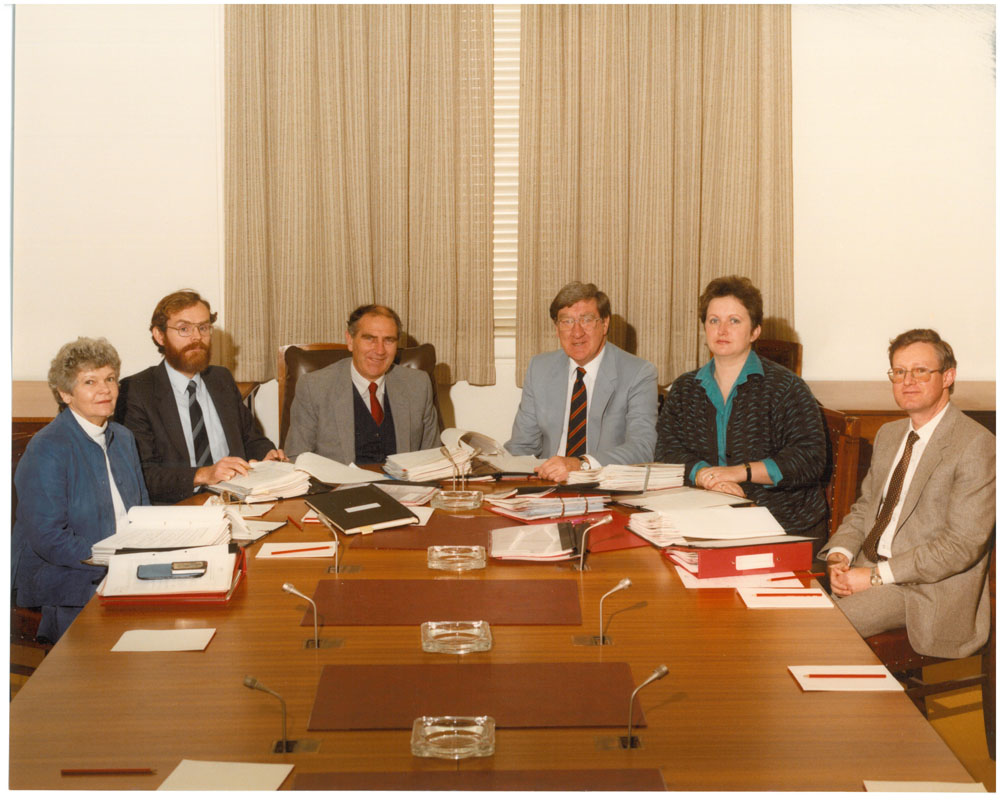Standing Committee on Regulations and Ordinances, 2 June 1986. L-R: Senator Patricia Giles, Peter Oâ€™Keeffe [Secretary], Senators Barney Cooney [Chair], Austin Lewis [Deputy Chair] and Amanda Vanstone, and John Carter [Research Officer].