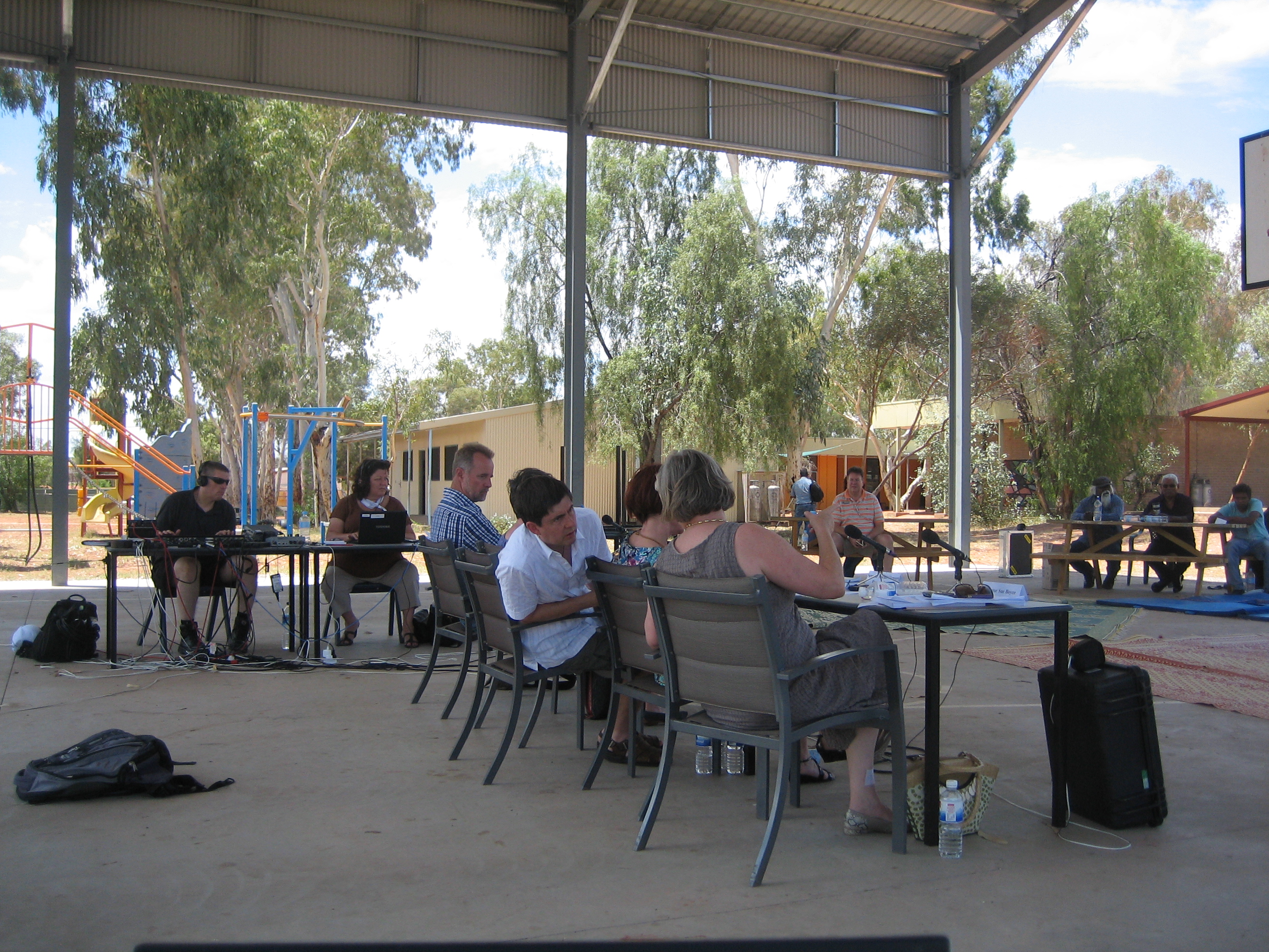 \x3cp\x3eCommunity Affairs Legislation Committee, Ntaria (Hermannsburg), NT, 20 February 2012. L-R: Broadcasting and Hansard officers, Senators Nigel Scullion and Claire Moore (obscured), Dr Ian Holland [Secretary], Senators Rachel Siewert and Sue Boyce.\x3c/p\x3e