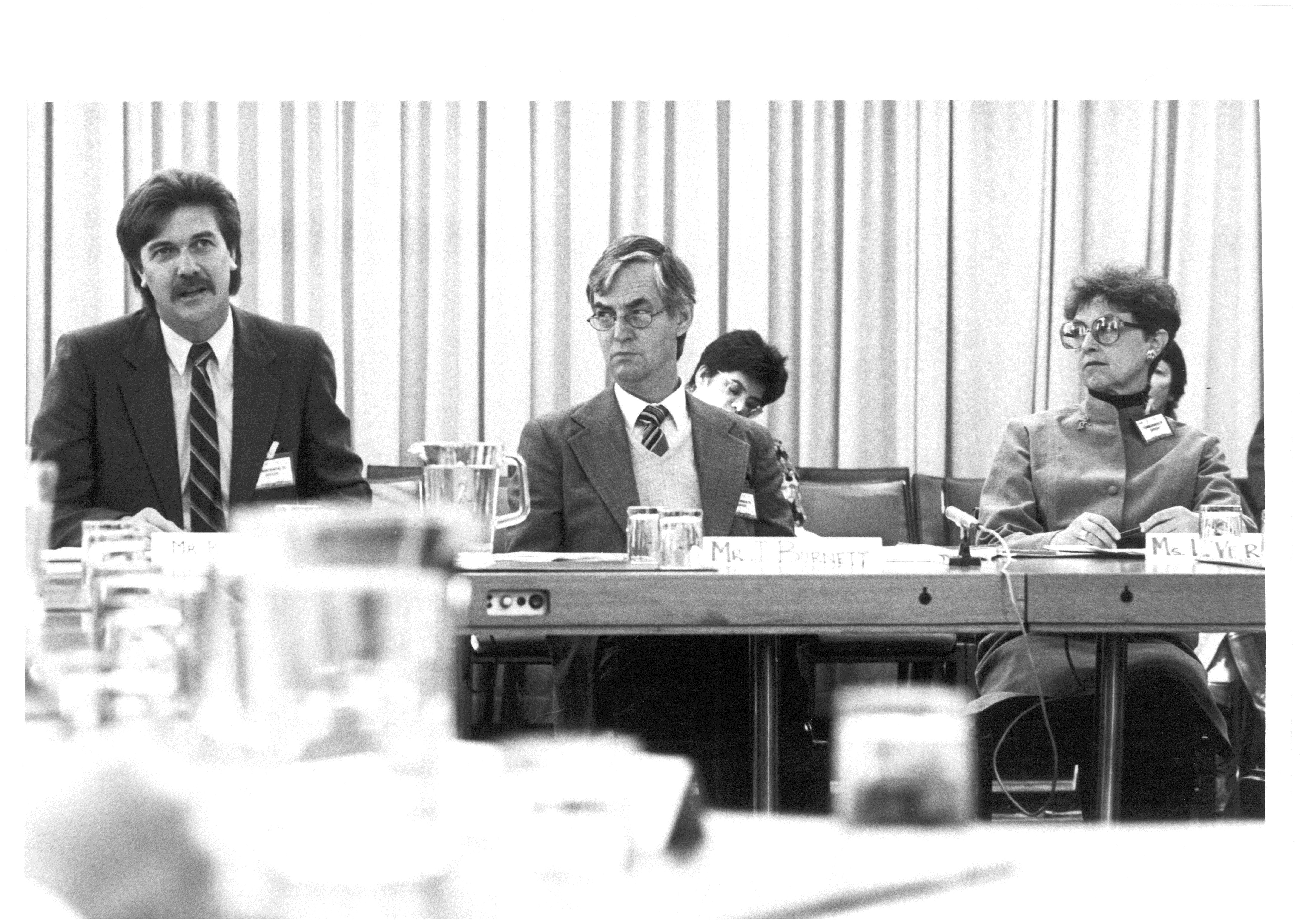\x3cp\x3eOfficers from the Department of Education and Commonwealth Schools Commission appearing before the Standing Committee on Education and the Arts, 14 July 1986. L-R: Witnesses Ross Harris, John Burnett and Lois Verrall.\x3c/p\x3e