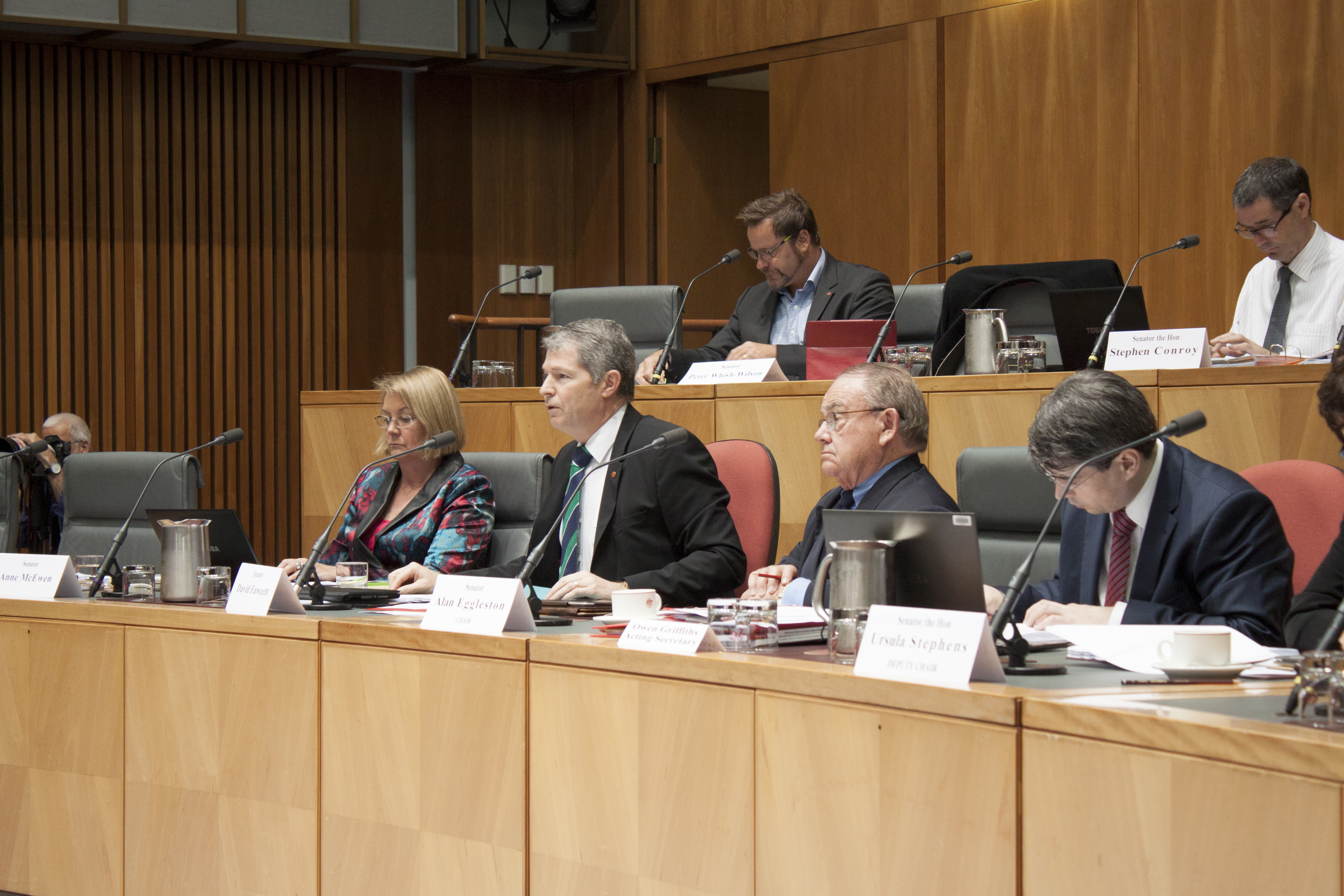 \x3cp\x3eForeign Affairs, Defence and Trade Legislation Committee budget estimates hearing, 2 June 2014. Top row L-R: Senators Peter Whish-Wilson and Stephen Conroy. Bottom row L-R: Senators Anne McEwen, David Fawcett and Alan Eggleston [Chair], and Owen Griffiths [Acting Secretary].\x3c/p\x3e