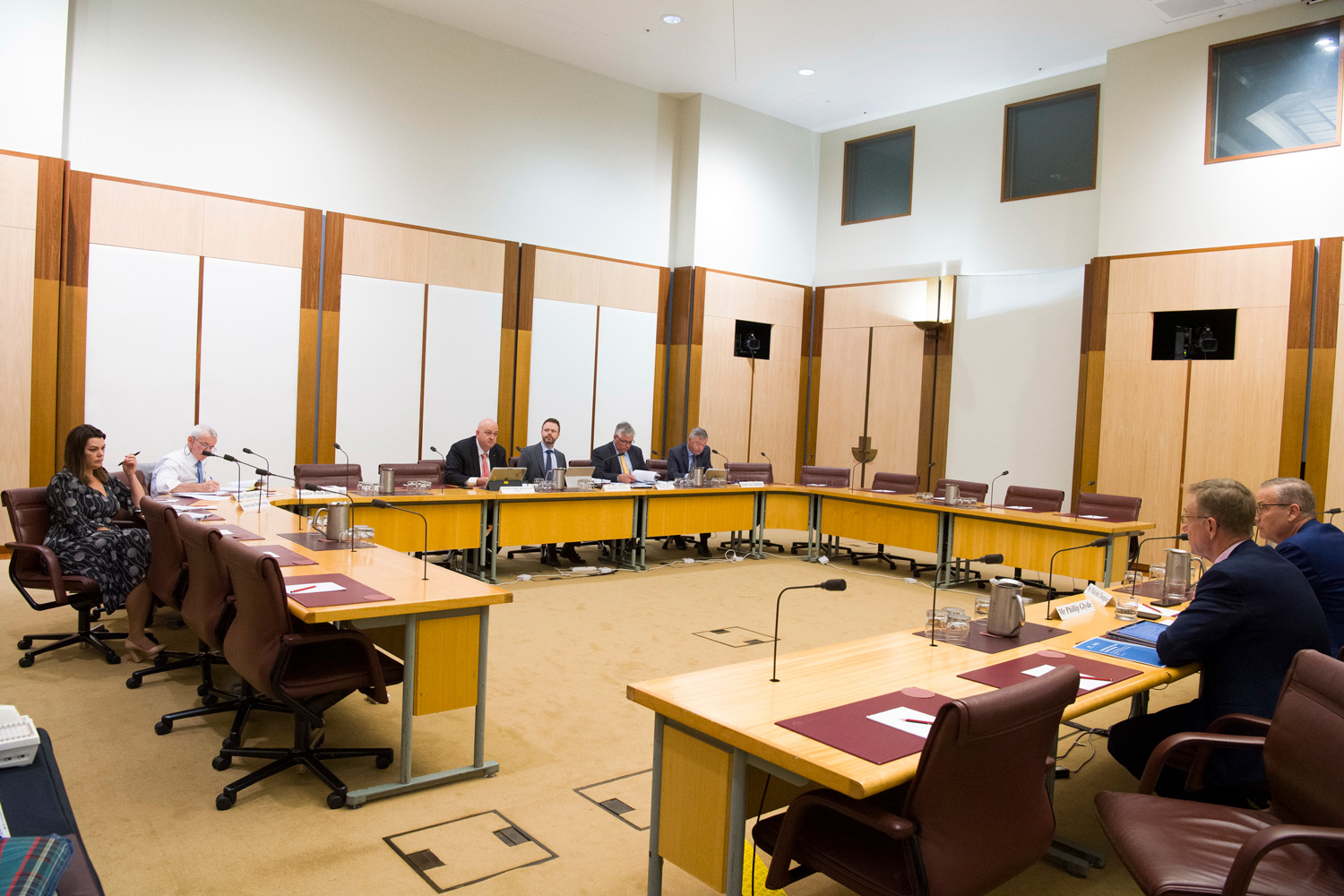 Canberra hearing, 18 October 2019. L-R: Senators Sarah Hanson-Young, Malcolm Roberts and Slade Brockman, Committee Secretary Sean Turner, Senators Rex Patrick and  Alex Gallacher and witnesses Phillip Glyde [Chief Executive, Murray-Darling Basin Authority] and Malcolm Thompson [Deputy Secretary, Department of Agriculture].